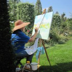 Kunstenaar hard aan het werk op schilderij tijdens schilderdag
